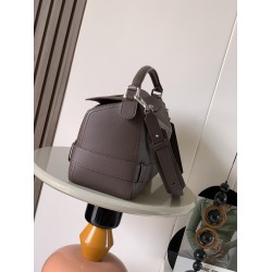 1180 Large Glossy Cowhide Puzzle Biker HandbagPuzzle with distinctive geometric lines that define the rectangular shapeThis large version is made of glossy cowhide leather with biker-inspired detailingCan be worn over the shoulderCrossbody or handheldDeta