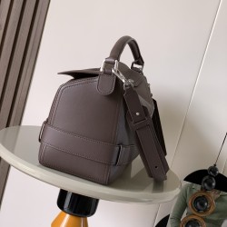 1180 Large Glossy Cowhide Puzzle Biker HandbagPuzzle with distinctive geometric lines that define the rectangular shapeThis large version is made of glossy cowhide leather with biker-inspired detailingCan be worn over the shoulderCrossbody or handheldDeta