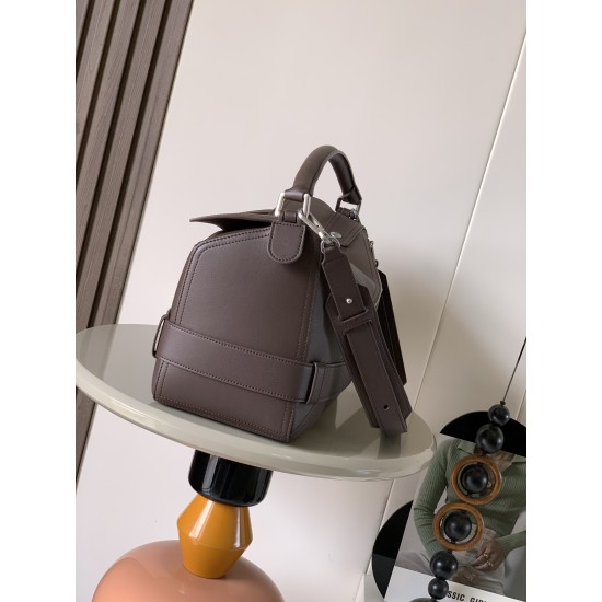 1180 Large Glossy Cowhide Puzzle Biker HandbagPuzzle with distinctive geometric lines that define the rectangular shapeThis large version is made of glossy cowhide leather with biker-inspired detailingCan be worn over the shoulderCrossbody or handheldDeta