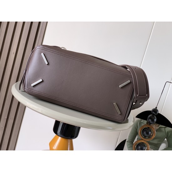 1180 Large Glossy Cowhide Puzzle Biker HandbagPuzzle with distinctive geometric lines that define the rectangular shapeThis large version is made of glossy cowhide leather with biker-inspired detailingCan be worn over the shoulderCrossbody or handheldDeta