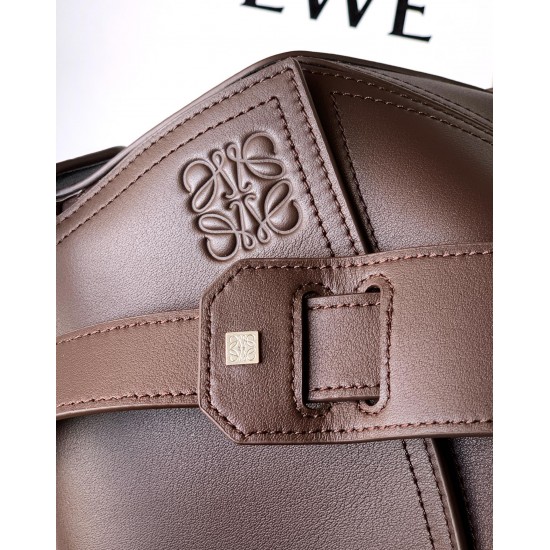 1180 Large Glossy Cowhide Puzzle Biker HandbagPuzzle with distinctive geometric lines that define the rectangular shapeThis large version is made of glossy cowhide leather with biker-inspired detailingCan be worn over the shoulderCrossbody or handheldDeta