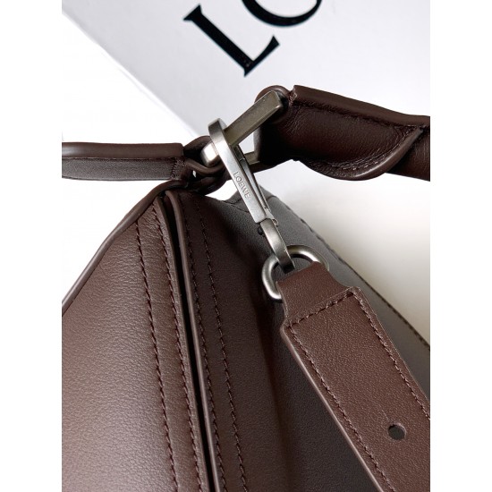 1180 Large Glossy Cowhide Puzzle Biker HandbagPuzzle with distinctive geometric lines that define the rectangular shapeThis large version is made of glossy cowhide leather with biker-inspired detailingCan be worn over the shoulderCrossbody or handheldDeta