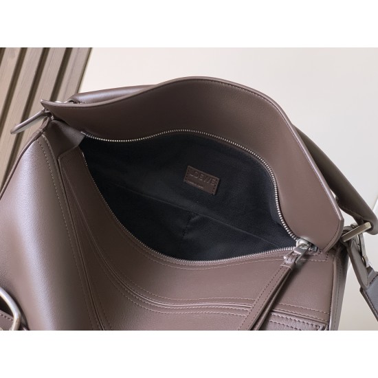 1180 Large Glossy Cowhide Puzzle Biker HandbagPuzzle with distinctive geometric lines that define the rectangular shapeThis large version is made of glossy cowhide leather with biker-inspired detailingCan be worn over the shoulderCrossbody or handheldDeta