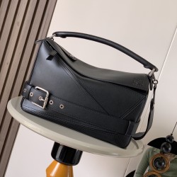 1180 Original Large Glossy Cowhide Puzzle Biker HandbagPuzzle with distinctive geometric lines outlining the rectangular shapeThis large version is made of glossy cowhide leather with biker detailsShoulder or hand carryCrossbody or hand carryRemovable and