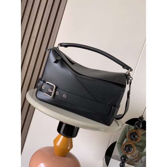 1180 Original Large Glossy Cowhide Puzzle Biker HandbagPuzzle with distinctive geometric lines outlining the rectangular shapeThis large version is made of glossy cowhide leather with biker detailsShoulder or hand carryCrossbody or hand carryRemovable and