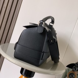 1180 Original Large Glossy Cowhide Puzzle Biker HandbagPuzzle with distinctive geometric lines outlining the rectangular shapeThis large version is made of glossy cowhide leather with biker detailsShoulder or hand carryCrossbody or hand carryRemovable and