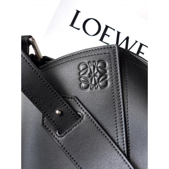 1180 Original Large Glossy Cowhide Puzzle Biker HandbagPuzzle with distinctive geometric lines outlining the rectangular shapeThis large version is made of glossy cowhide leather with biker detailsShoulder or hand carryCrossbody or hand carryRemovable and