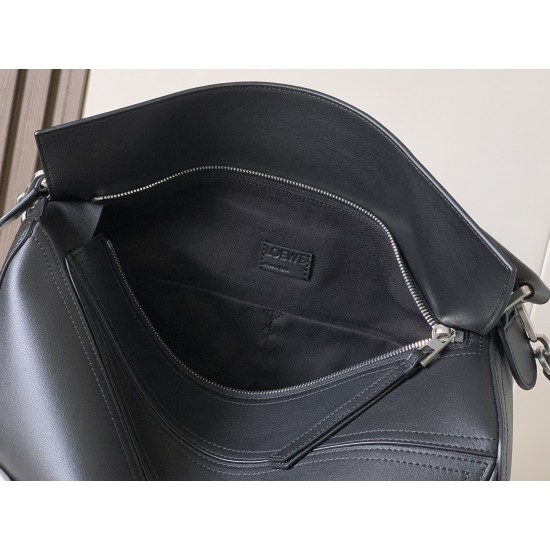 1180 Original Large Glossy Cowhide Puzzle Biker HandbagPuzzle with distinctive geometric lines outlining the rectangular shapeThis large version is made of glossy cowhide leather with biker detailsShoulder or hand carryCrossbody or hand carryRemovable and