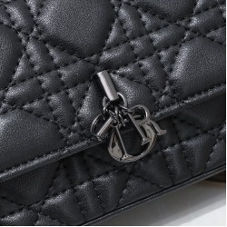 200 WITH BOX LADY DIOR MOBILE PHONE POUCH BLACK GUN CLOSURE This Lady Dior cell phone pouch is elegantly crafted in creamy white sheepskin leather with a rattan check pattern and a removable light gold-tone metal DIOR charm with a detachable chain adorned