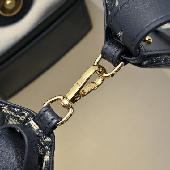 210 This Diorstar bucket bag from the Spring 2016 Ready-to-Wear collection is a smart, practical design with a versatile aesthetic crafted in materials such as blue Oblique printed fabric and embellished with smooth cowhide details in the same hue for a s