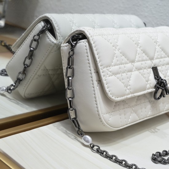 200 WITH BOX LADY DIOR MOBILE PHONE POUCH WHITE GUN CLOSURE This Lady Dior cell phone pouch is elegantly crafted in creamy white sheepskin leather with a rattan check pattern and a removable light gold-tone metal DIOR charm with a detachable chain adorned