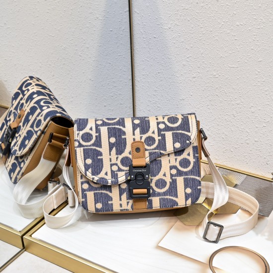 NEW SHIPPING 260 ORIGINAL BLUE FABRIC FEATURED TOP OF THE LINE WITH LEATHER ORIGINAL This mini saddle messenger bag is smart and stylish, crafted in black grained cowhide leather with a flap closure and the DIOR logo to emphasize the sophistication and ch