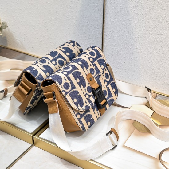 NEW SHIPPING 260 ORIGINAL BLUE FABRIC FEATURED TOP OF THE LINE WITH LEATHER ORIGINAL This mini saddle messenger bag is smart and stylish, crafted in black grained cowhide leather with a flap closure and the DIOR logo to emphasize the sophistication and ch