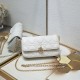 200 WITH BOX LADY DIOR MOBILE PHONE POUCH WHITE GOLD BUCKLE This Lady Dior cell phone pouch is elegantly crafted in creamy white sheepskin leather with a rattan check pattern and a removable light gold finish metal DIOR charm with a detachable chain adorn