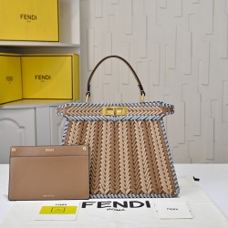 410 Model 33200 New! New in stock New in stock Iconic Peekaboo ISeeU large handbag Handmade leather weave with signature twist lock on both sidesSoft leather lining in the same color visible from the outsideTwo compartments separated by a rigid dividerFea