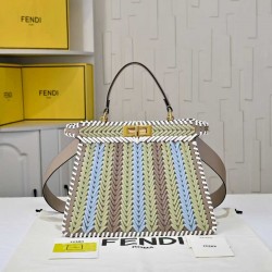 410 Model 33200 New! New in stock New in stock Iconic Peekaboo ISeeU large handbag Handmade leather weave with signature twist lock on both sidesSoft leather lining in the same color visible from the outsideTwo compartments separated by a rigid dividerFea