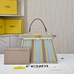 410 Model 33200 New! New in stock New in stock Iconic Peekaboo ISeeU large handbag Handmade leather weave with signature twist lock on both sidesSoft leather lining in the same color visible from the outsideTwo compartments separated by a rigid dividerFea