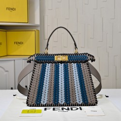 410 Model 33200 New! New in stock New in stock Iconic Peekaboo ISeeU large handbag Handmade leather weave with signature twist lock on both sidesSoft leather lining in the same color visible from the outsideTwo compartments separated by a rigid dividerFea