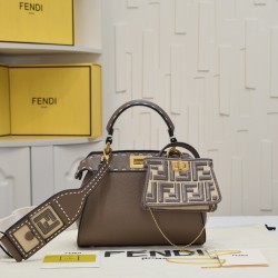 Model 3309320NEWFendi's iconic Peekaboo ISeeU medium handbag in full-grain leatherLarge, hand-stitched sides with classic twist locksFrom the outside, you can see the full-grain leather lining in the same colorTwo compartments separated by a rigid divider