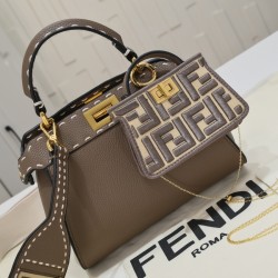 Model 3309320NEWFendi's iconic Peekaboo ISeeU medium handbag in full-grain leatherLarge, hand-stitched sides with classic twist locksFrom the outside, you can see the full-grain leather lining in the same colorTwo compartments separated by a rigid divider