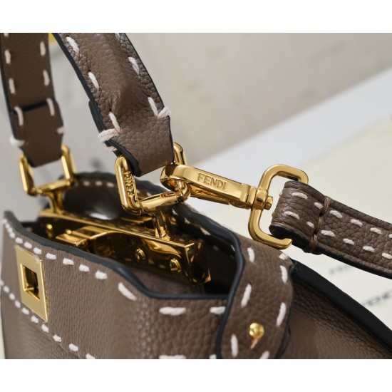 Model 3309320NEWFendi's iconic Peekaboo ISeeU medium handbag in full-grain leatherLarge, hand-stitched sides with classic twist locksFrom the outside, you can see the full-grain leather lining in the same colorTwo compartments separated by a rigid divider