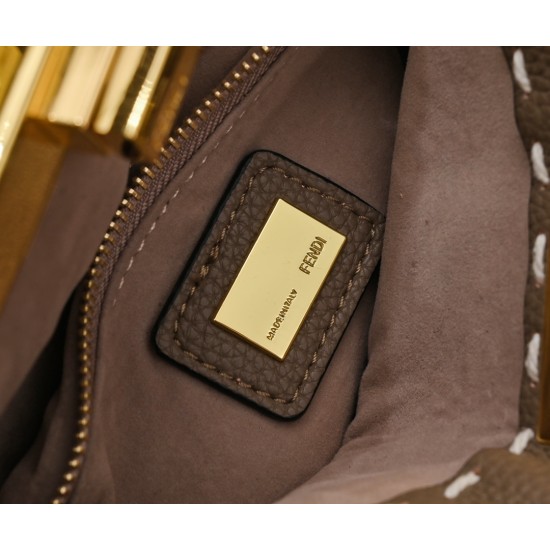 Model 3309320NEWFendi's iconic Peekaboo ISeeU medium handbag in full-grain leatherLarge, hand-stitched sides with classic twist locksFrom the outside, you can see the full-grain leather lining in the same colorTwo compartments separated by a rigid divider