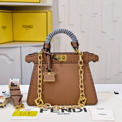 350 model 7705 the iconic peekaboo iseeu ideal compact handbag is hand-stitched with 306 stitches in the same color and large bright threads representing traditional selleria craftsmanship in a selection of dove grey cuoio romano leather with iconic natur