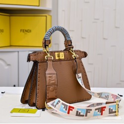 350 model 7705 the iconic peekaboo iseeu ideal compact handbag is hand-stitched with 306 stitches in the same color and large bright threads representing traditional selleria craftsmanship in a selection of dove grey cuoio romano leather with iconic natur