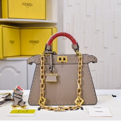 350 model 7705 the iconic peekaboo iseeu ideal compact handbag is hand-stitched with 306 stitches in the same color and large bright threads representing traditional selleria craftsmanship in a selection of dove grey cuoio romano leather with iconic natur