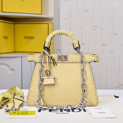 350 model 7705 the iconic peekaboo iseeu ideal compact handbag is hand-stitched with 306 stitches in the same color and large bright threads representing traditional selleria craftsmanship in a selection of dove grey cuoio romano leather with iconic natur