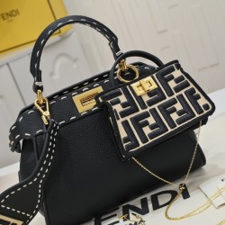 Model 3309320NEWFendi's iconic Peekaboo ISeeU medium handbag in full-grain leatherLarge, hand-stitched sides with classic twist locksFrom the outside, you can see the full-grain leather lining in the same colorTwo compartments separated by a rigid divider