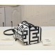 170 Model No. 8950Fendi Roma capsule collectionTwo-tone print Mon Tresor small bucket bag in black and whiteFendi Roma logo reinterpreted by Marc Jacobs in a full-length oversized shapeLined interior and silver-tone finishMetal pieces with Fendi Roma Marc