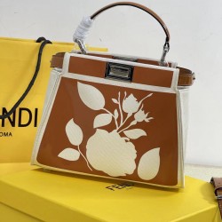 Upgraded Cowhide 390 with BoxFendi's new iconic Peekaboo pouch in black canvas and patent leather is engraved with a rose motif displaying a natural canvas backgroundThe sides are decorated with a signature twist lockTwo compartments are lined with canvas
