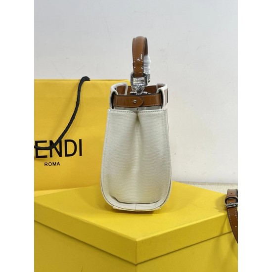 Upgraded Cowhide 390 with BoxFendi's new iconic Peekaboo pouch in black canvas and patent leather is engraved with a rose motif displaying a natural canvas backgroundThe sides are decorated with a signature twist lockTwo compartments are lined with canvas