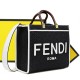 With 330FEND1 SunshineMedium tote bag in denimDenim with FENDI Mirror pattern on all sidesHard brown leather handles with FENDI ROMA letteringFeatures spacious lined interior compartmentsLeather silhouette and gold-tone finishMetal hardwareFeatures two ca