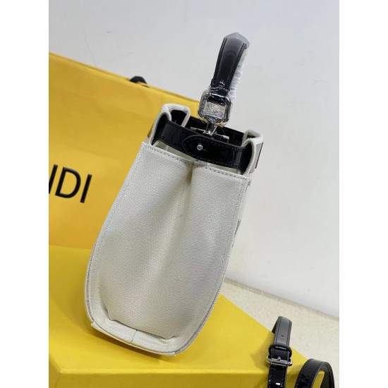 Upgraded Cowhide Lot 390 with Box Fendi's new iconic Peekaboo pouch in black canvas and patent leather is engraved with a rose motif displaying a natural canvas backing and is adorned with a signature twist lock on both sides.Canvas liningTwo compartments