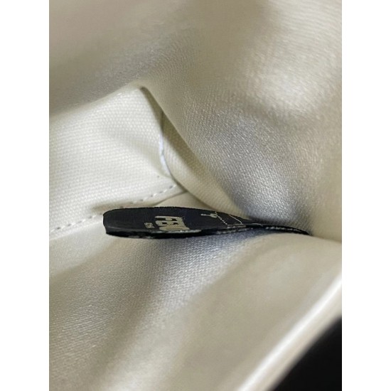 Upgraded Cowhide Lot 390 with Box Fendi's new iconic Peekaboo pouch in black canvas and patent leather is engraved with a rose motif displaying a natural canvas backing and is adorned with a signature twist lock on both sides.Canvas liningTwo compartments