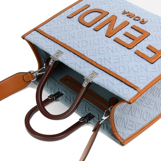 Lot 330FEND1 Sunshine medium tote bag in denim with FENDI Mirror pattern all over brown rigid leather handles decorated with FENDI ROMA features spacious lined interior compartments leather silhouette and gold finish metal pieces with two carry handles an