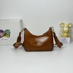 OILED LEATHER VINTAGE NEW RISE TRIPLE REPRODUCTION 2005 ICONIC STYLE SHOULDER BAG Coalescing Prada's design codes into a sophisticated and versatile silhouette creates a dialogue between past and present styles ADJUSTABLE SHOULDER STRAP METAL COMPONENTS D