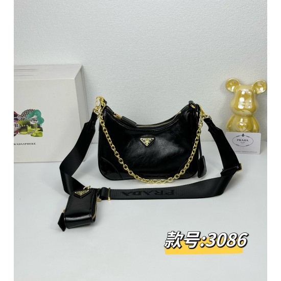 OILED LEATHER VINTAGE NEW RISE TRIPLE REPRODUCTION 2005 ICONIC STYLE SHOULDER BAG Coalescing Prada's design codes into a sophisticated and versatile silhouette creates a dialogue between past and present styles ADJUSTABLE SHOULDER STRAP METAL COMPONENTS D