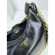 OILED LEATHER VINTAGE NEW RISE TRIPLE REPRODUCTION 2005 ICONIC STYLE SHOULDER BAG Coalescing Prada's design codes into a sophisticated and versatile silhouette creates a dialogue between past and present styles ADJUSTABLE SHOULDER STRAP METAL COMPONENTS D