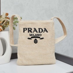 280 Prada Crossbody Bag in raffiaThis softly deconstructed crossbody bag is crafted in raffia, a lightweight, natural material that expresses the heart of summerThe iconic house triangle logo is reintroduced to decorate the front of the bagEmbroidered let