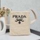 280 Prada Crossbody Bag in raffiaThis softly deconstructed crossbody bag is crafted in raffia, a lightweight, natural material that expresses the heart of summerThe iconic house triangle logo is reintroduced to decorate the front of the bagEmbroidered let
