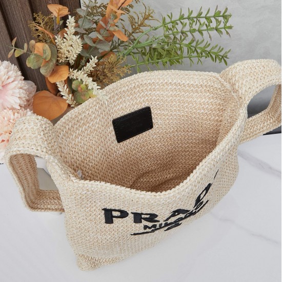 280 Prada Crossbody Bag in raffiaThis softly deconstructed crossbody bag is crafted in raffia, a lightweight, natural material that expresses the heart of summerThe iconic house triangle logo is reintroduced to decorate the front of the bagEmbroidered let