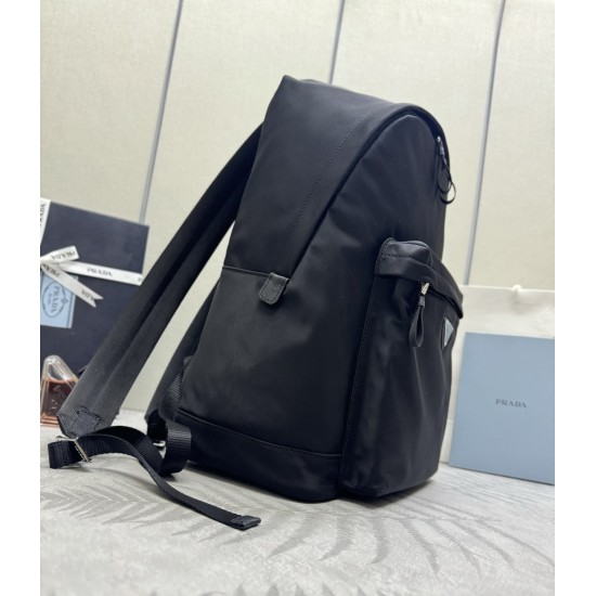 F520 Classic Shoulder Bag Newest Shoulder Bag 2V066A Made of imported Saffiano leather and imported nylon fabric Adjustable nylon shoulder straps Brushed metal hardware This nylon backpack with multiple pockets and padded back design is quite a design fea